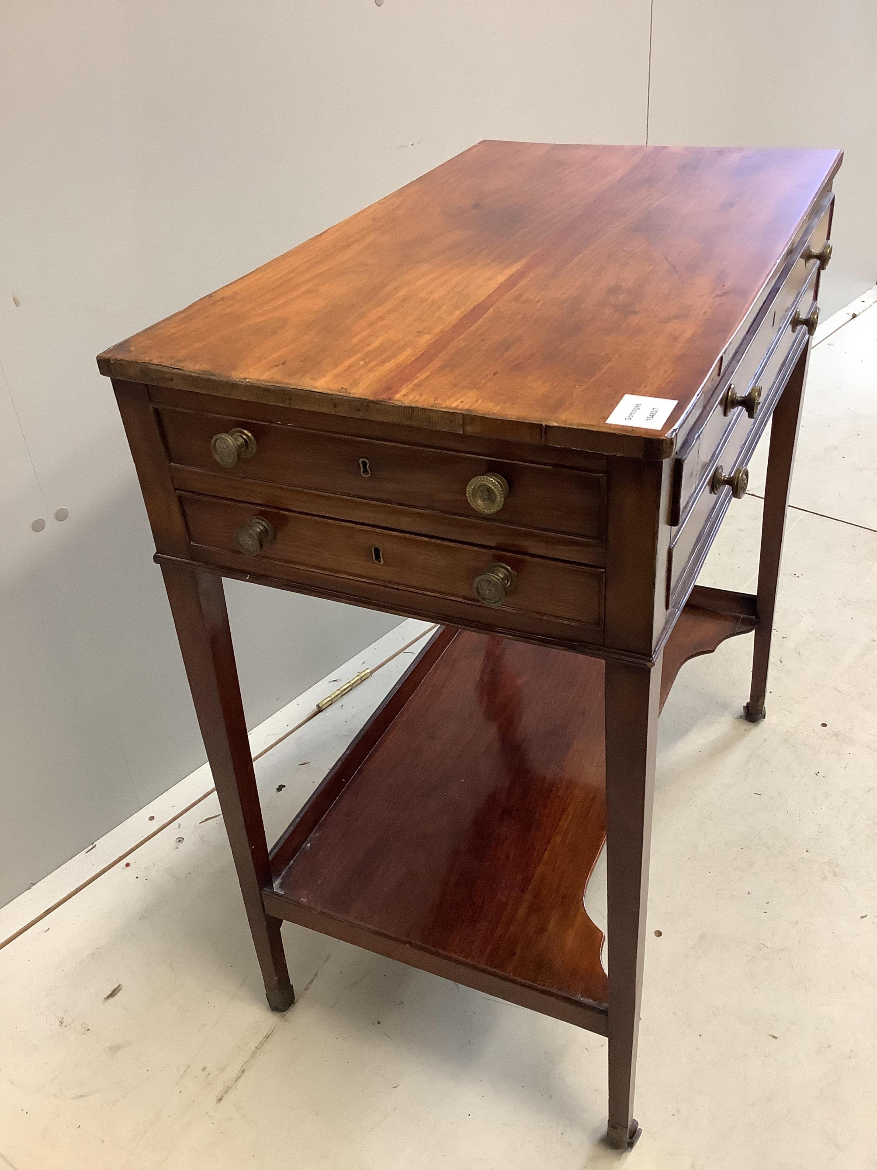 A George III mahogany two drawer side table, fitted with an undertier, width 67cm, depth 40cm, height 76cm. Condition - fair